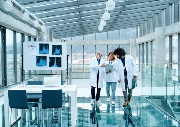 Group of doctors talking about corona virus on conference, midsection